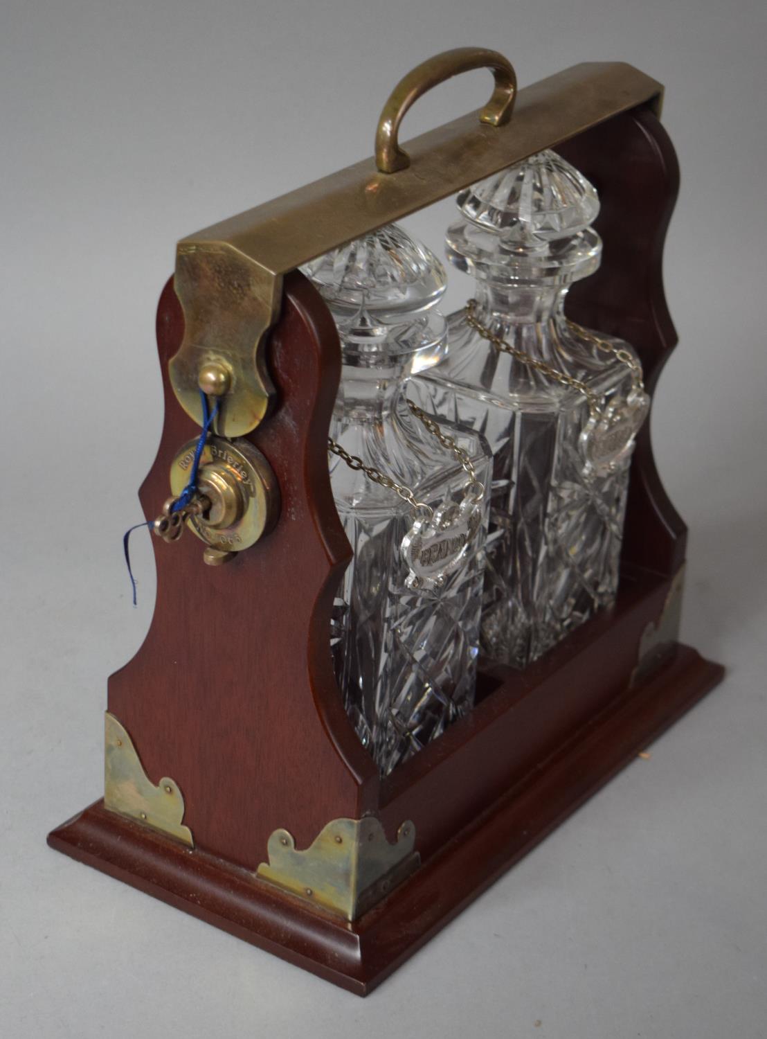 A Reproduction Silver Plate Mounted Two Bottle Tantalus with Whisky and Brandy Decanter Labels - Image 2 of 3