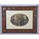 An Early 20th Carved Oak Frame Containing Oval Photo of Husband and Wife, 72cm wide