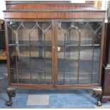 An Edwardian Mahogany Galleried Bow Fronted Display Cabinet on Short Cabriole Supports with Claw and