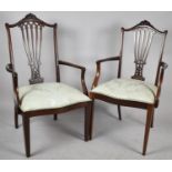 A Pair of Edwardian Mahogany "His and Hers" Open Armchairs with Pierced Splats
