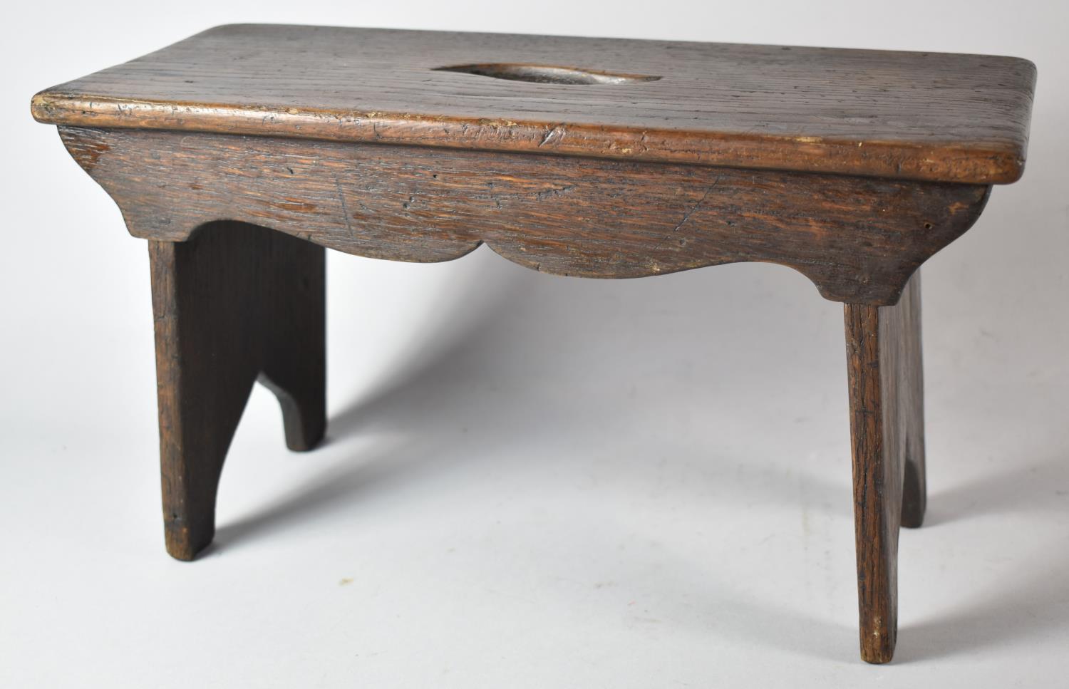 A Small Stained Oak Rectangular Topped Stool, 35cm Long