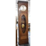 An Edwardian Walnut Long Case Clock with Westminster Chime Movement.