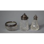 A Silver and Cut Glass Silver Three Piece Cruet