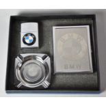 A Collection of BMW Branded Smokers Items to Include Cigarette Case, Lighter and Small Ashray (We