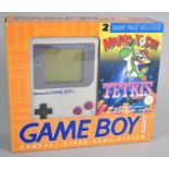 A Nintendo Game Boy Compact Video Game System with Two Games, Mario and Yoshi and Tetris