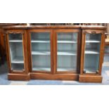A Late 19th Century Rosewood Reverse Breakfront Sideboard with Four Glazed Panelled Doors to Shelved