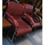 A Pair of Vintage Chrome Based Leather Upholstered "Girsberger" Open Armchairs