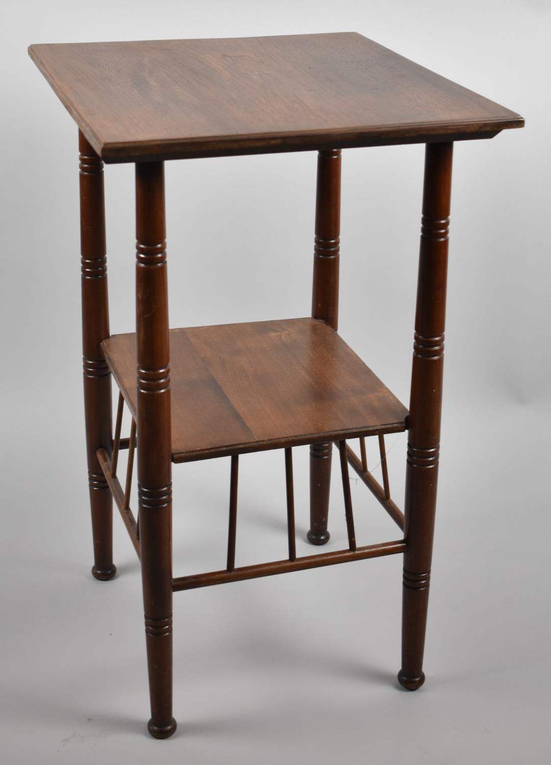 An Early 20th Century Walnut Arts and Crafts Two Tier Occasional Table on Turned Supports with