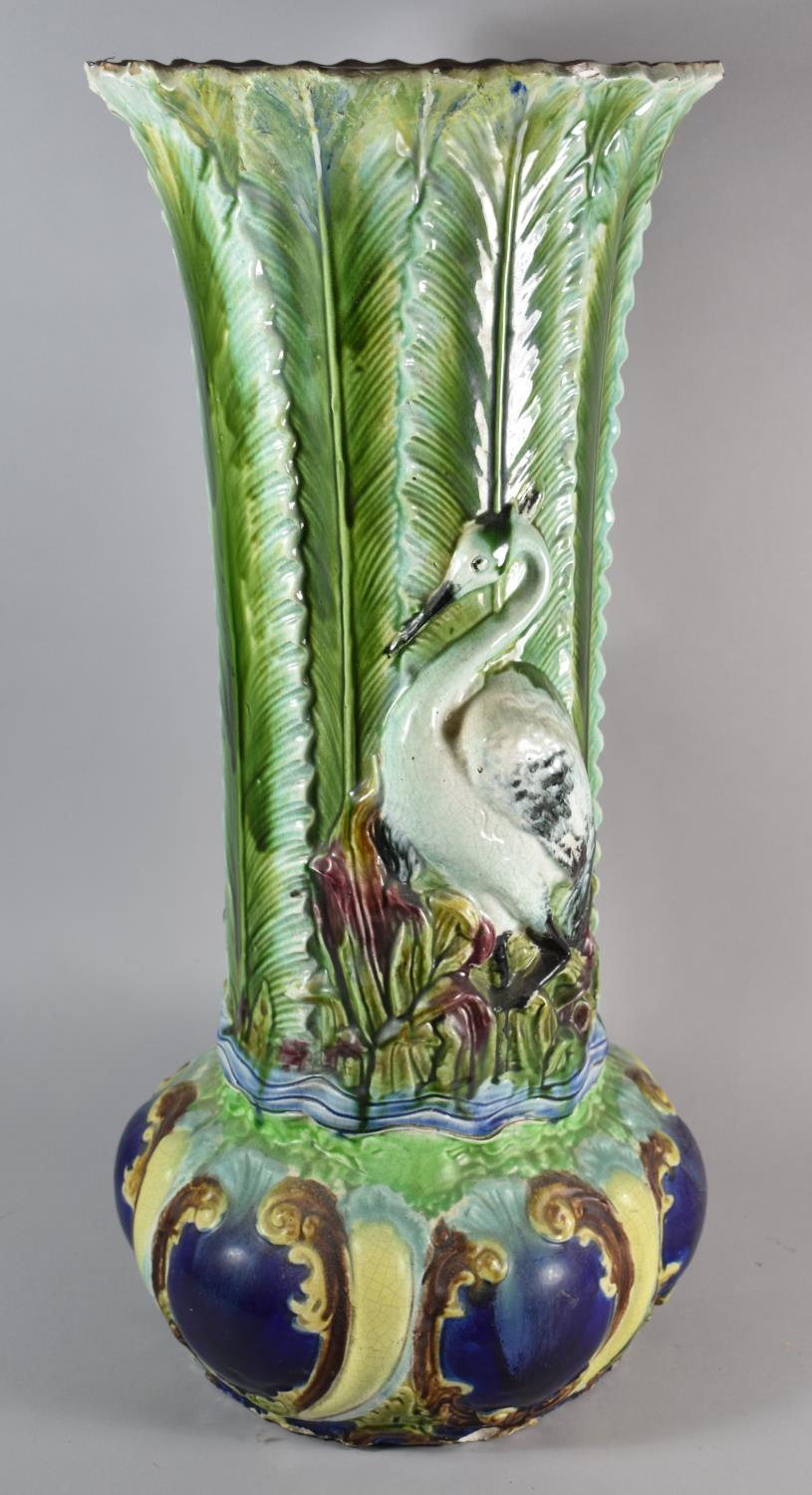 A Continental Majolica Jardiniere Stand of Waisted Form Decorated in Relief in Usual Colour