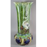 A Continental Majolica Jardiniere Stand of Waisted Form Decorated in Relief in Usual Colour