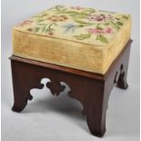 A 19th Century Gothic Style Mahogany Foot Footstool with Tapestry Seat Above Fretwork Apron with