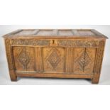 A Carved Oak Three Panel Coffer Base with Four Panel Lid, 132cm wide