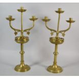 A Pair of Ecclesiastical Brass Three Branch Candelabra on Circular Bases, 46cm high