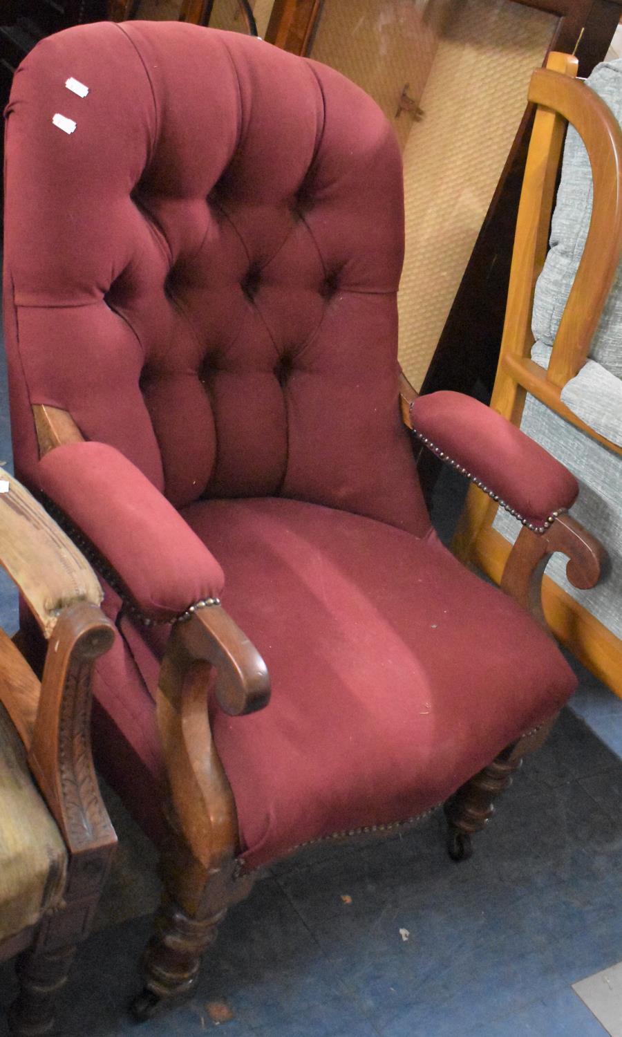A Mid 19th Century Buttoned Backed Mahogany Framed Open Armchair with Scrolled Terminals