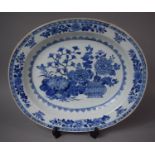 A 19th Century Chinese Export Blue and White Oval Serving Platter with Vase and Chrysanthemum