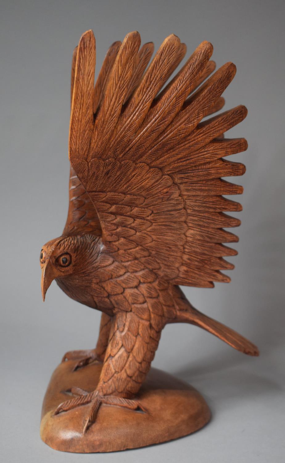 A Carved Wooden Study of Eagle with Wings Outstretched, 39cm high