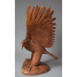 A Carved Wooden Study of Eagle with Wings Outstretched, 39cm high