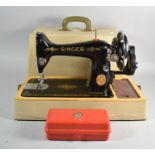 A 1938 Singer Sewing Machine with Buttonhole Attachment