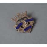 A Silver and Enamel Badge for the "Young Helpers League" in the Form of a Crown
