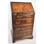 A Reproduction Mahogany Fall Front Bureau with Fitted Interior and Four Drawers to Base, 58cm Wide