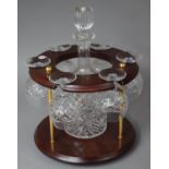 A Modern Brass and Mahogany Circular Decanter and Six Brandy Balloon Set