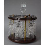A Circular Mahogany and Brass Decanter and Six Wine Glass Stand, 27cm Diameter