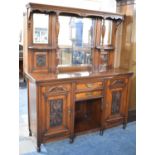 A Late 19th Century Mirror Back Sideboard with Two Centre Drawers and Open Display Flanked by Carved