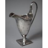 A Georgian Silver Cream Jug with Reeded Handle and Gadrooned Rim On Square Plinth Base of Tapering