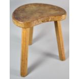 A Robert Thompson "Mouseman" Three Legged Stool with Kidney Shaped Seat and Carved Mouse Trademark