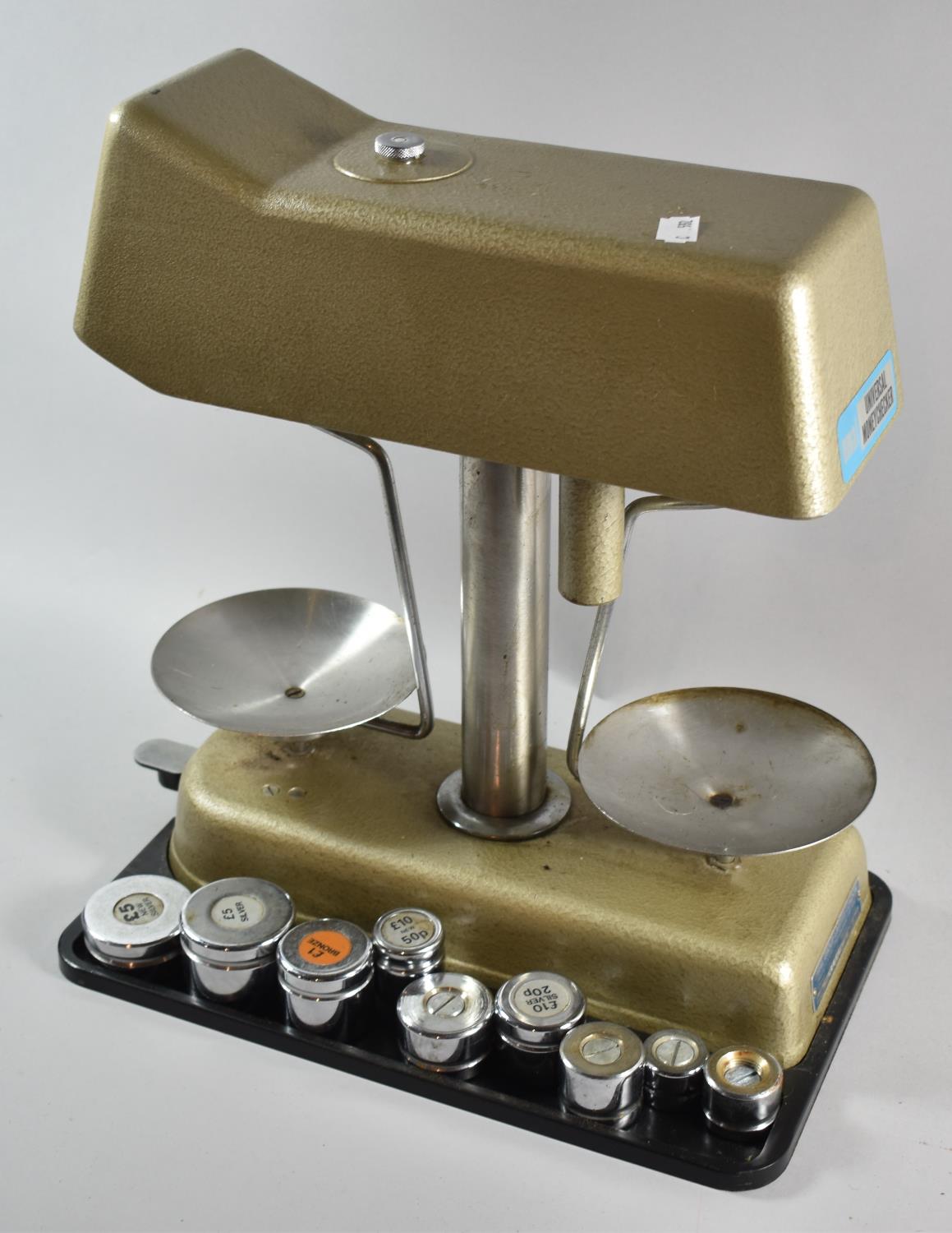 A Vintage Universal Money Checker with Weights