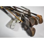 A Collection of Various Vintage Golf Clubs