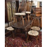 An Ercol Drop Leaf Dining Table and Six Ercol Hooped Spindle Back Chairs