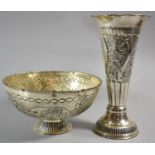 An Indian Pressed White Metal Bowl Decorated with Elephants and a Floral Decorated Trumpet Vase,