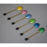 A Set of Six Harlequin Coloured Enamelled Coffee Bean Spoons