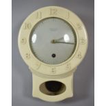 A Vintage Cream Bakelite Wall Mounting Clock by Smiths Enfield, 26cm high