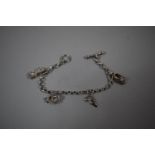 A Silver Bracelet with Four Charms, Stamped 925