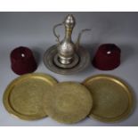 A Collection of Moroccan Souvenir Metal Wares to Include Coffee Pot, Brass Chargers, Two Fez Hats