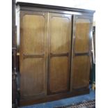 An Edwardian Mahogany Triple Wardrobe with Panelled Doors and Plinth Base, 178cm wide