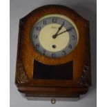 An Edwardian Oak Wall Clock by Bentima, 32cm high