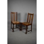 A Pair of Edwardian Oak Framed Dining Chairs with Tapestry Pad Seats