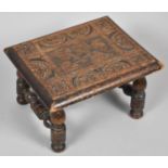 An Edwardian Carved Oak Rectangular Topped Stool on Turned Supports, 31cm wide