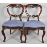 A Pair of Victorian Balloon Back Mahogany Framed Chairs on Cabriole Front Legs