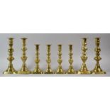 Four Sets of Victorian Brass Candlesticks