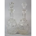 A Pair of Globe and Stalk Decanters (Different Stoppers), 33.5cm High