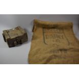 A Wooden Military Grenade Box with Iron Hinges and Clasp Together with a Vintage Hessian Sack for