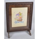 An Edwardian Oak Framed Silk Embroidered Fire Screen Depicting Santa Maria, 59cm wide