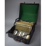 A Hohner Alpina Accordion in Case