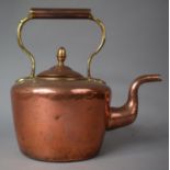 A Copper Kettle with Acorn Final, 30cm high