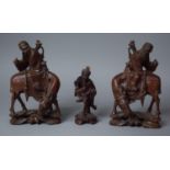 A Pair of Early/Mid 20th Century Carved Wooden Oriental Studies of Travelers on Horses Together with