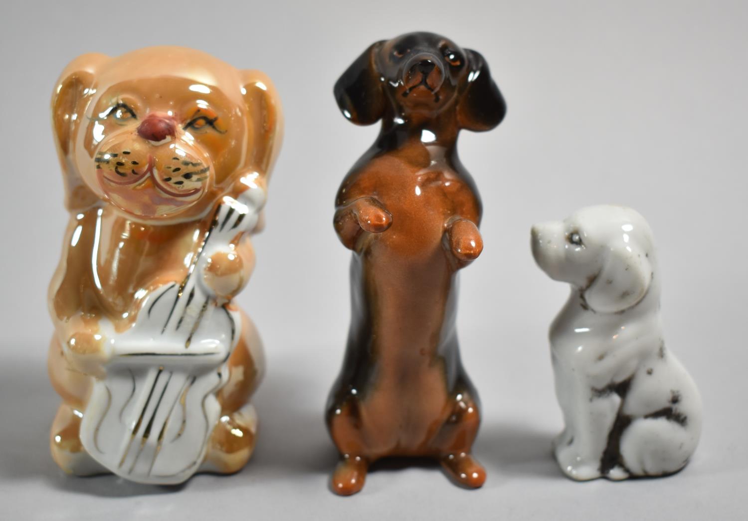 Three Dog Figures to Include Japanese Lustre, White Porcelain Example and One Beswick Figure,